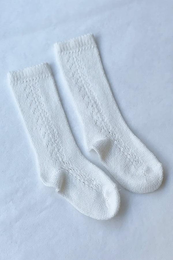Chaussettes hautes bébé en coton chaud blanc cassé. A porter avec une barboteuse au printemps ou à l'automne - Fil de Légende Paris, Neuilly-sur-Seine